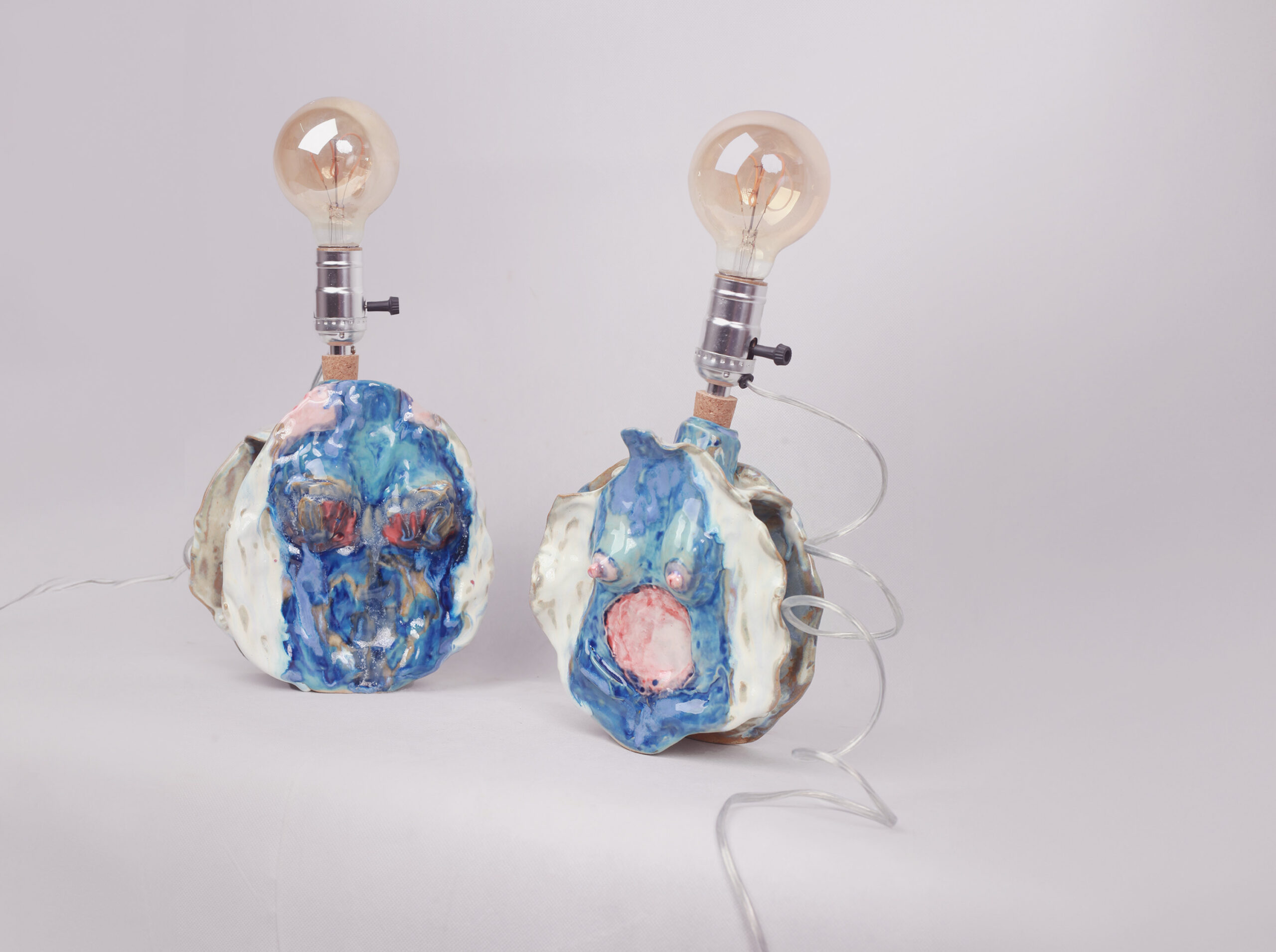 Ceramic sculptural lamp collection by Hoang Dan Pham for Arthouse Hand-Fetish-Project. Triple-fired for subtle layered blue tones. An eclectic functional artwork.