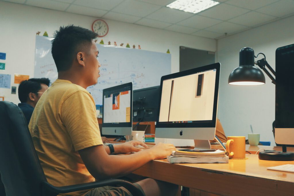 Creative professional working in an advertising agency, reflecting how the Southeast Asian Art World often emerged through commercial design and agency culture.